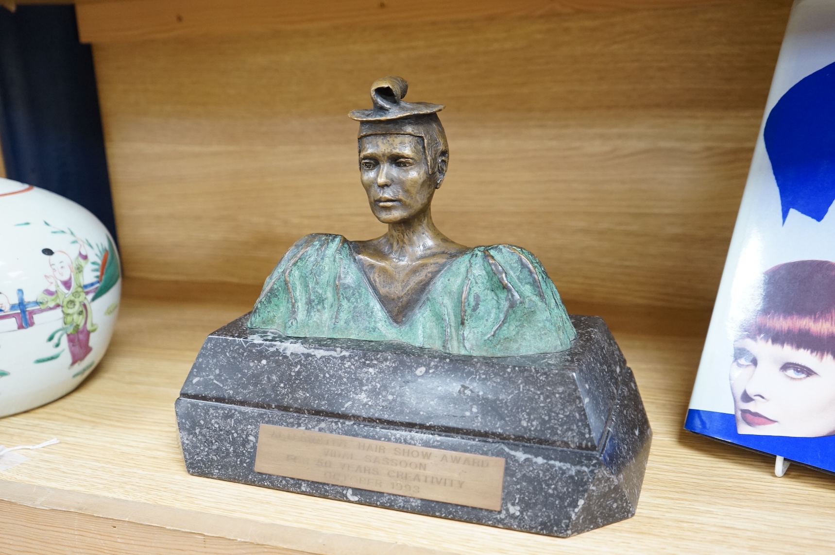 A figural bronze award: Alternative Hair Show Award Vidal Sassoon for 50 Years Creativity October 1993, together with Vidal Sassoon Fifty Years Ahead, a photographic history of his work. Award 29cm wide x 25cm high.